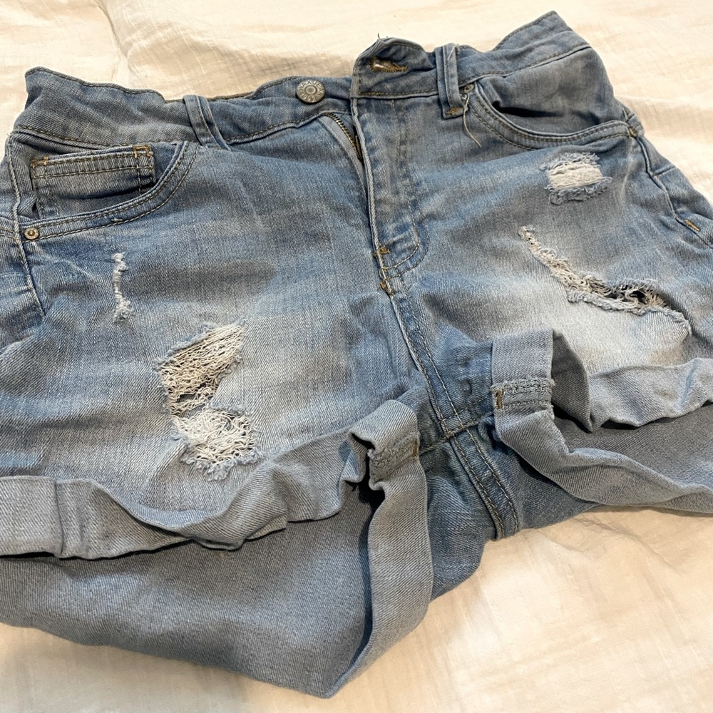 Light blue Jean shorts. Size 0-2. Never cute jeans just are not worn anymore.